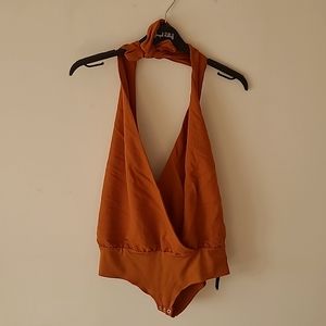 Loose fit, deep V, halter body suit from Zara. Rustic Orange Colour. Size Small